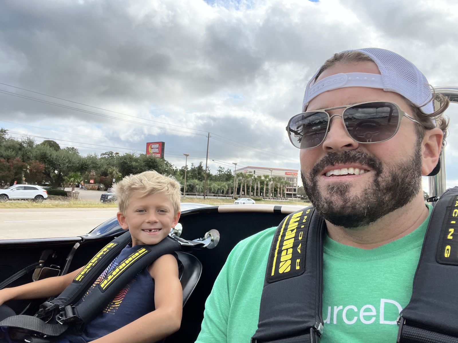 Tom and his son in a classic roadster
