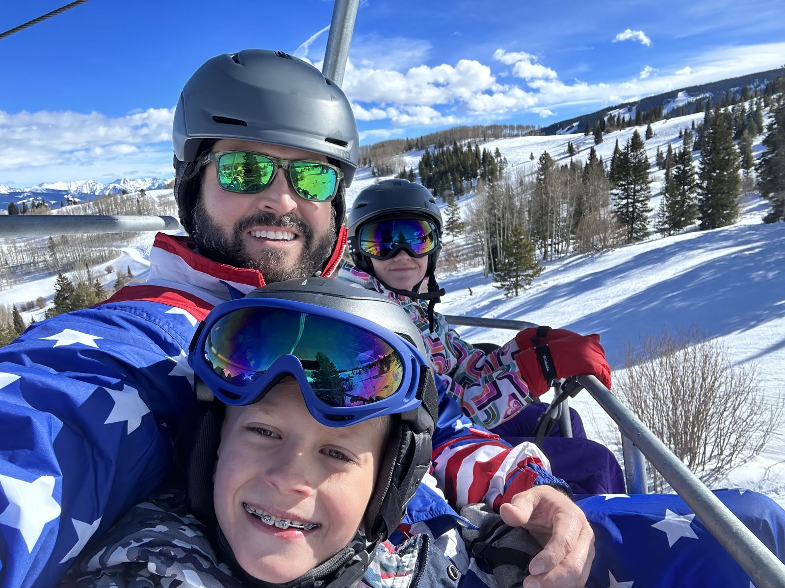 Tom and his kids on a ski lift